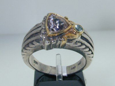 BJC 14k Yellow Gold/Silver CZ & Blue Topaz Ring: BJC 14k Yellow Gold/Silver Blue Topaz & CZ Ring. The total ring's weight is 10.5 grams.The measurement of the ring's face is 20 x 12 mm, Thickness: 9 mm.The weight of the Blue Topaz is 7 pts. The weig