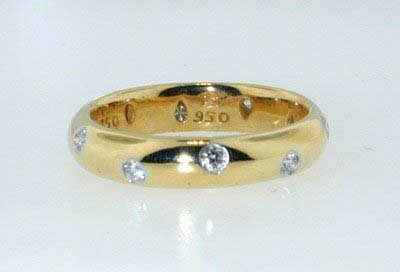 Tiffany & Co. Platinum and 18K Yell: Beautiful Tiffany & Co. Platinum and 18K Yellow Gold Band! 50 pt diamonds, G color, and VS clarity. The ring weighs 5 g. The width of the ring is 3 mm and the thickness is 1 mm. The size of the ring i