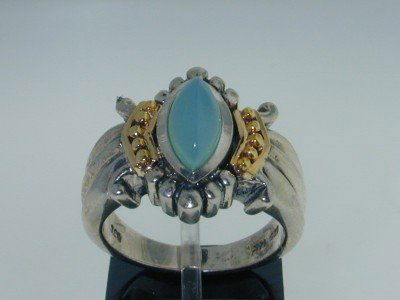 BJC Silver/14K Yellow Gold Chalcedony Ring.: This Is A Wonderful BJC Silver/14K Yellow Gold Chalcedony Ring. The total ring's weight is 8.7 grams. The size of the chalcedony is 10x5 mm. The measurement of the ring's surface is 16x15 mm and the b