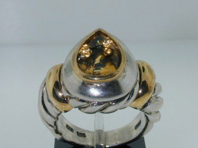 BJC Silver/14k Yellow Gold Citrine Ring !!: BJC Silver/14k Yellow Gold Citrine Ring.The total ring's weight is 11.5 grams.The size of the pear shape citrine is 12 x 8 mm.The measurement of the ring's surface is 20x18 mm and Thickness: 8 mm.The