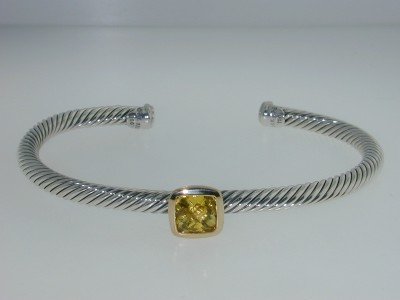 David Yurman18k Gold/Silver Lemon Citrine Bangle!: David Yurman 18k Yellow Gold/Silver Lemon Citrine Bangle! Bangle's Weight : 16.8 grams. The size of the Lemon Citrine is 9x9 mm. The measurements of the Bangle are 60x44 mm and the thickness is 4 mm.
