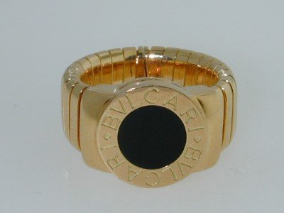 Bvlgari 18K Yellow Gold Onyx Ring!!: Authentic Bvlgari 18K Yellow Gold Onyx Ring The total ring's weight is 18.7 grams. The size of the ring is 5.25 Size of Onyx: 8 mm in diameter. Ring is 13 mm wide. There are stamp "750" and "Bvlgari"