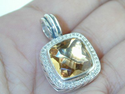David Yurman Silver Diamond Citrine Pendant.: Beautiful David Yurman Silver Citrine Diamond Pendant.The total pendant's weight is 11.5 grams.The total weight of the Diamond is 0.40 cts approximately, H color VS clarity.The size of Citrince: 13 x 
