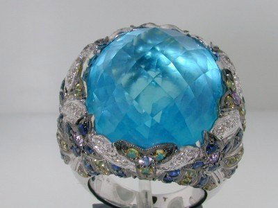 18K White Gold Diamond & Sapphire & Blue Topaz Rin: 18K white Gold Diamond & Multi-color Sapphire & Blue Topaz Ring. The total ring's weight is 26.3 grams. The total diamond weight is 40 pts. , approximately, H color, SI1 clarity. Total weight of Sapph