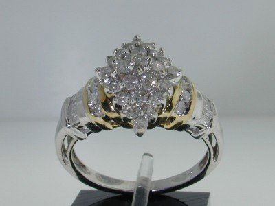 10K Two-tone Gold Diamond Ring.: This is a Wonderful 10K Two-tone Gold Diamond Ring. The total ring's weight is 4.5 grams. Total weight of diamond: 55 pts, approximately, I color, SI clarity The width of ring's face: 15 mm The size o