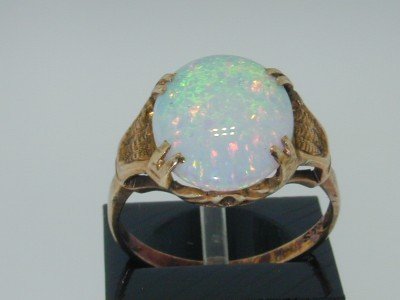 10K Yellow Gold Opal Ring!!: This is a Wonderful 10k Yellow Gold Opal Ring , The total ring's weight is 2.0 grams. The size of opal is 10x12 mm. The size of the ring is 4.25". This is a beautiful ring !