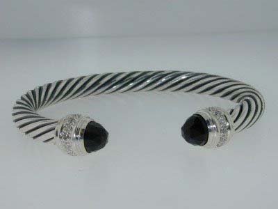 David Yurman Silver Diamond Bangle !!: David Yurman Onyx & Diamond Bangle in Silver. The total Bangle 's weight is 39.4 grams. The total diamond weight is 30 pts approximately,H color VS clarity. The size of the Onyx is 7x7 mm, each. The b