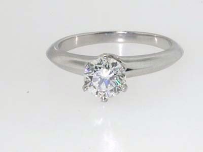 Tiffany & Co. Platinum Diamond Ring!!: Beautiful Tiffany & Co. Platinum Solitaire Diamond Ring 76 pt diamond G Color VS Clarity. The weight of the ring is 4.9 g. The size of the ring is 6.