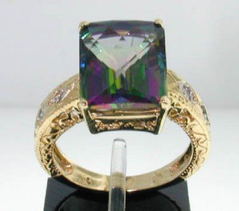 10K Yellow Gold Alexandrite Diamond Ring: 10K Yellow Gold Alexandrite Diamond Ring The total ring's weight is 5.6 grams. The size of Alexandrite: 12 x 10 mm Total weight of diamond: 4 pts, I color, SI clarity. The size of ring: 6"