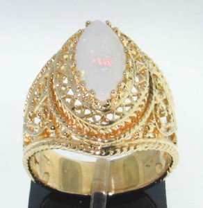 10k Yellow Gold Opal Ring: 10k Yellow Gold Opal Ring ! The total ring's weight is 6.3 grams. The size of opal is 12x6 mm ,approxmiately. The measurement of ring's face 20x15 mm . The size of the ring is 6.75"