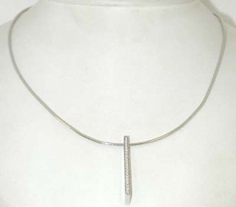 Movado 18K White Gold Diamond Necklace.: Movado 18K White Gold Diamond Necklace. The total weight of Necklace is 11.0 grams. The total weight of the Diamond is 0.19cts approximately, G color VS clarity. The size of pendant is 30x5 mm. The Ne