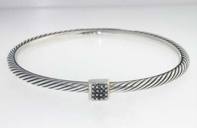 David Yurman Silver Onyx Bangle.: David Yurman Silver, Onyx Bangle. The total Bangle's weight is 11.5 grams. The total Onyx weight is 7 pts. The measurement of the inside bangle is 50x50 mm, Thickness: 2 mm. There is D.Y',925" stamp o