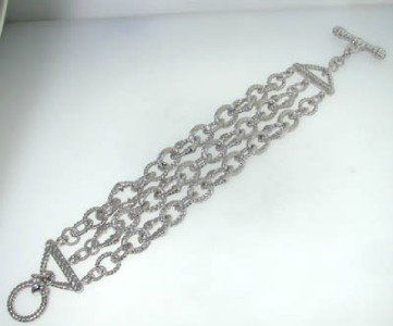 Judith Ripka Silver Bracelet.: The is a beautiful Judith Ripka Silver Bracelet. The total bracelet's weight is 54.4grams. The bracelet is 7.5" long. The size of the bracelet is 25 mm in wide. This is a beautiful bracelet!