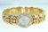 326: Juvenia 18K Yellow Gold, Diamond Bangle Watch.