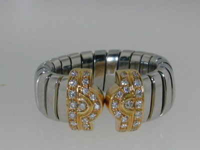 Bvlgari 18K Yellow Gold/Steel Diamond Ring: Authentic Bvlgari 18K Yellow Gold and Steel Diamond Ring The total ring's weight is 8.8 grams. The diamonds weight are approximately 0.34 ct., G color and VS clarity. The measurement on the surface of