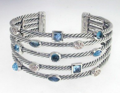 David Yurman Silver Diamond, Blue Topaz Bangle: David Yurman silver Diamond, Blue Topaz Bangle. Bangle's Weight : 49 grams. The weight of diamond: 0.21 cts, H color,VS clarity. The measurements of the Inside Bangle is 56 x 44 mm There is D.Y , Stem
