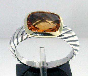 David Yurman 18k Yellow Gold/Silver citrine Ring: This is a Wonderful David Yurman 18k Yellow Gold/Silver Citrine Ring. The total ring's weight is 5.1 grams. The size of the Citrine is 10x8 mm. The size of the ring is 7.75