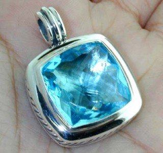 David Yurman Silver & 18K White Gold Blue Topaz Pe: This is a Wonderful David Yurman Silver & 18K White Gold Blue Topaz Pendant The total Pendant's weight is 18.7 grams. Pendant size is 35x25 mm, 5 mm thick. The size of Blue Topaz is 20x20mm.