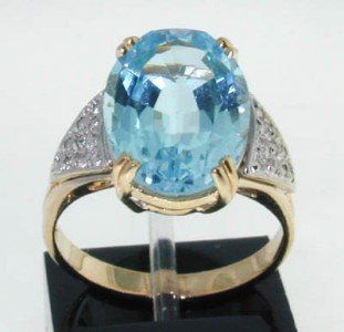 14K Yellow Gold Blue Topaz, Diamond Ring: 14K Yellow Gold Blue Topaz, Diamond Ring The total ring's weight is 4.9 grams. The size of Blue topaz: 14x10 mm The weight of Diamond is 0.2 cts, I color, SI clarity The size of ring: 6