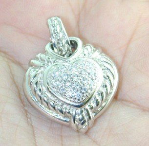 Judith Ripka Silver Diamonique Pendant: Authentic Judith Ripka Silver Diamonique (CZ'S) Pendant.The total Pendant weight is 15.6 grams.Size of heart shape pendant: 22 x 22 mm.Total weight of Diamonique (CZ'S): 0.9 cts.