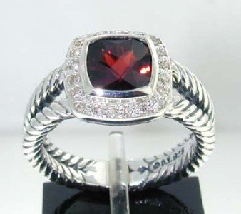 David Yurman Silver Rhodolite & Diamond Ring.: This is a Wonderful David Yurman Silver Rhodolite & Diamond Ring. The total ring's weight is 5.9 grams. The total weight of the diamond is 0.2 cts approximately, I color SI clarity. The size of the Rh