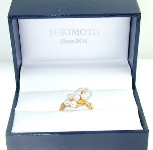 Mikimoto 18K Yellow Gold Pearl Diamond Ring.: Mikimoto 18K Yellow Gold pearl Diamond Ring. The total ring weight is 3.9 grams. The Total weight of Diamond is 0.04 pts. approximately .H color VS clarity. There are total 8 pearls on ring, Size: 3 m