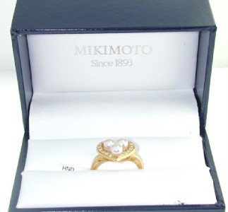 Mikimoto 18K Yellow Gold Pearl Diamond Ring.: Mikimoto 18K Yellow Gold pearl Diamond Ring. The total ring weight is 4.1 grams. The Total weight of Diamond is 0.16 cts. approximately . H color VS clarity. There are total 3 pearls on ring, Size: 3 