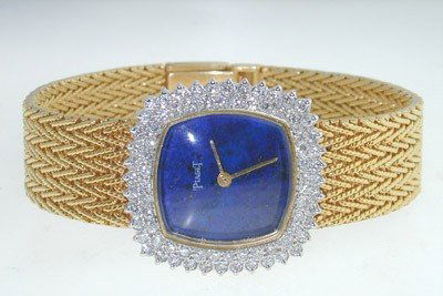 Piaget 18K Yellow Gold Diamond Watch.: Piaget 18K Yellow Gold Diamond Watch. Watch's Weight 62.6 grams. The total diamond weight: 3.5 cts. G color, VS clarity. The length of watch: 6" Swiss made. Water resistant. Chian is 12 mm wide.