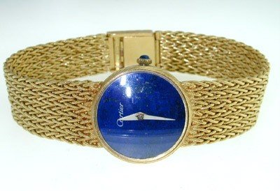 Cartier 18K Yellow Gold,Cabochon Sapphire Watch: Cartier 18K Yellow Gold, Cabochon Sapphire Watch. The total watch's weight is 51.7 grams. The measurements of watch head is 20 x 21 mm and 5 mm thick. The measurements of Cabochon Sapphire: 2 mm. The 
