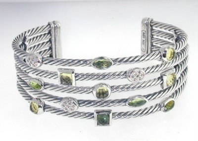 David Yurman Silver Diamond, Peridot Bangle: David Yurman silver Diamond,Peridot Bangle. Bangle's Weight : 53.1 grams. The weight of diamond: 0.21 cts, H color,VS clarity. The measurements of the Inside Bangle is 59 x 46 mm There is D.Y , Stemp 