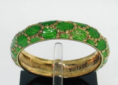 Tiffany & Co 18K Yellow Gold Green Enamel Ring.: Tiffany & Co 18K Yellow Gold Green Enamel Ring. The total ring's weight is 5.3 grams. The size of the ring is 7.25 This is a beautiful ring!