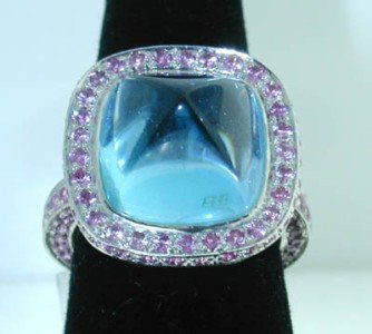 Laura Munder 18K Gold Blue Topaz and Pink Sapphire: Laura Munder 18K White Gold Blue Topaz, Diamond and Pink Sapphire Ring The total weight of Ring is 20.4 grams. Size of Blue Topaz are approximately 14x14 mm Total weight of Pink Sapphire are approxima
