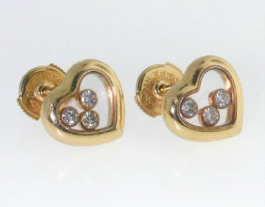 Chopard 18K Yellow Gold Happy Diamond Earrings: Chopard 18K Yellow Gold Happy Diamond Earrings ! The total Earrings' weight is 7 grams. The total diamond weight is 0.3 cts ,approximately. G color, VS clarity. The Size of the earrings is 9 x 9 mm. T