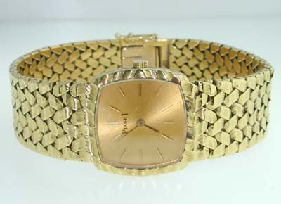 Piaget 18K Yellow Gold Watch.: Piaget 18K Yellow Gold Watch. Watch's Weight 60.2 grams. The length of watch: 5.5" Swiss made Water resistant Chian is 13 mm wide.