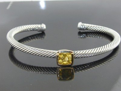 David Yurman 18k Yellow Gold/Silver Citrine Bangle: David Yurman 18k Yellow Gold/Silver Citrine Bangle! Bangle's Weight: 16.8 grams. The size of Citrine is 7x7 mm. The measurements of the inside Bangle are 57 x 42 mm and the thickness is 4 mm. There is