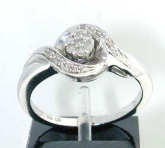 10K White Gold Diamond Ring: 10K White Gold Diamond Ring. The total ring's weight is 3.3 grams. The total weight of Diamond is approximately 25 pts. I color I2 clarity. The size of the ring is 7