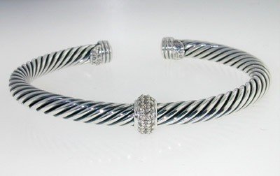 David Yurman Silver, Diamond Bangle: David Yurman Silver, Diamond Bangle! Bangle's Weight : 25.6 grams. Total diamonds weight: 0.31 cts, I color, SI-1 clarity. The measurements of the inside Bangle are 48 x 40 mm and the thickness is 3 m