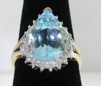 10K 2-tone Gold Blue Topaz, Diamond Ring: 10K 2-tone Gold Blue Topaz, Diamond Ring The total ring's weight is 4.7 grams. The size of Topaz: 15x10mm Total weight of diamond: 0.21cts, I color, SI clarity. The size of ring's face: 20x15 mm wide.