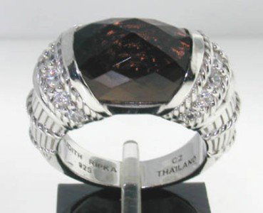 Judith Ripka Silver Smoky Topaz and Diamonique Ring: Judith Ripka Silver Smoky Topaz and Diamonique (CZ'S) Ring ! The total ring weight is 11.0g The measurements of Smoky Topaz: 12x8mm The total weight of Diamonique (CZ'S): 0.7cts The measure of the rin
