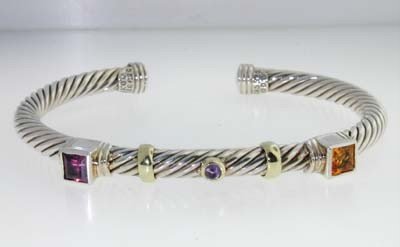 David Yurman 14k Yellow Gold/Silver Multi-Stone Ban: David Yurman 14k Yellow Gold/Silver Multi-Stone Bangle!Bangle's Weight : 30.8 grams.Multi-Stone are citrine, amythist, pink topaz.The measurements of the inside Bangle are 62 x 42 mm and the thickness