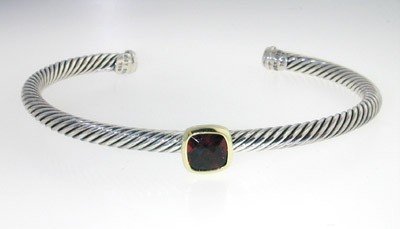 David Yurman 18k Yellow Gold/Silver Garnet Bangle!: David Yurman 18k Yellow Gold/Silver Garnet Bangle! Bangle's Weight : 18 grams.The size of Granet is 6 x 6 mm.The measurements of the inside Bangle are 56 x 45 mm and the thickness is 4 mm.There is Sta