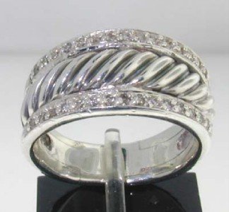 David Yurman Silver Diamond Ring: David Yurman Silver Diamond Ring The total ring's weight is 10.9 grams. The total weight of the diamond is 0.63 cts approximately, I color SI clarity. The size of the ring is 6.5" There is a stamp DY,
