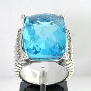 David Yurman Silver Blue Topaz Diamond Ring: This is a Wonderful David Yurman Silver Blue Topaz Diamond Ring. The total ring's weight is 9.8 grams. The total diamond weight is 0.25 ct ,approxmiately. I color SI clarity. The size of Blue Topaz is