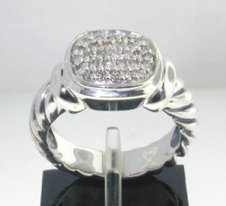 David Yurman Silver Diamond Ring: This is a Wonderful David Yurman Silver, Diamond Ring , The total ring's weight is 5.6 grams. The total weight of diamond is 0.31 cts. approximately , H color VS clarity. The size of the ring's surfac