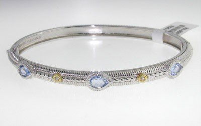 Judith Ripka 18K Gold,Silver,Diamond, Blue Topaz Ba: Judith Ripka 18K Yellow Gold, Silver, Diamond & Blue Topaz Bangle ! The total weight of Bangle is 16.6 grams. The total weight of diamond is 0.1 cts. approximately, I color SI clarity. The measurement