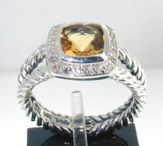 David Yurman Silver, Citrine & Diamond Ring: David Yurman Silver, Citrine & Diamond Ring The total ring's weight is 5.4 grams. The total weight of the diamond is 0.24 cts approximately, I color SI clarity. The size of the Citrine is 7 mm. The si