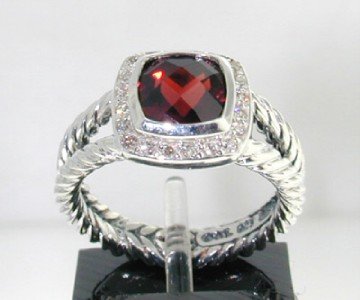David Yurman Silver, Garnet & Diamond Ring: David Yurman Silver, Garnet & Diamond Ring The total ring's weight is 5.6 grams. The total weight of the diamond is 0.24 cts approximately, I color SI clarity. The size of the Garnet is 7 mm. The size