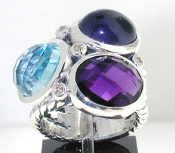 David Yurman Silver Muti-color Stone & Diamond Rin: David Yurman Silver Ring with BLue Topaz, Amethyst, Cabochon Sapphire & Diamond The total ring's weight is 14.6 grams. The total weight of Diamond: 0.12 cts. H color, SI clarity The size of the ring i