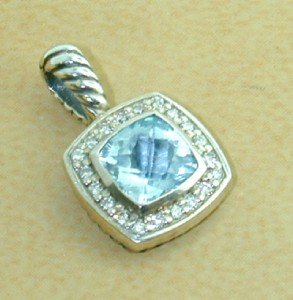 David Yurman Silver Blue Topaz & Diamond Pendant: David Yurman Silver Blue Topaz & Diamond Pendant. The total Pendant's weight is 2.9 grams. The total weight of diamonds is 0.24 cts. approximately I and SI clarity. The size of the Blue Topaz is 7 mm 