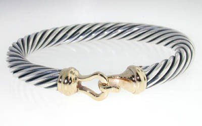 David Yurman 14k Yellow Gold & Silver Bangle!: David Yurman 14k Yellow Gold & Silver Bangle!Bangle's Weight : 41.5 grams.The measurements of the Bangle are 55x45 mm and the thickness is 7 mm.There is Stamp D.Y, 585, 925 on it.